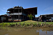 Inle Lake Myanmar. All the buildings are constructed on piles. Residents travel around by canoe, but there are also bamboo walkways and bridges over the canals, monasteries and stupas. 